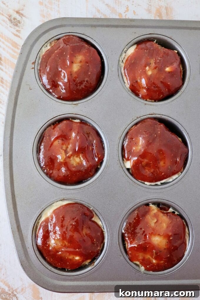 Maple-Glazed Mini Meatloaves Recipe 9 bbq glazed mini meatloaves in a muffin tin