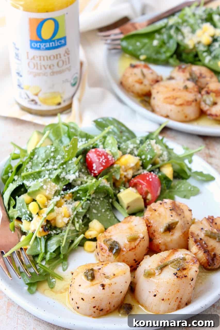 Grilled Scallops in Spicy Jalapeño-Lemon Butter Sauce 4 Grilled scallops on plate with arugula salad