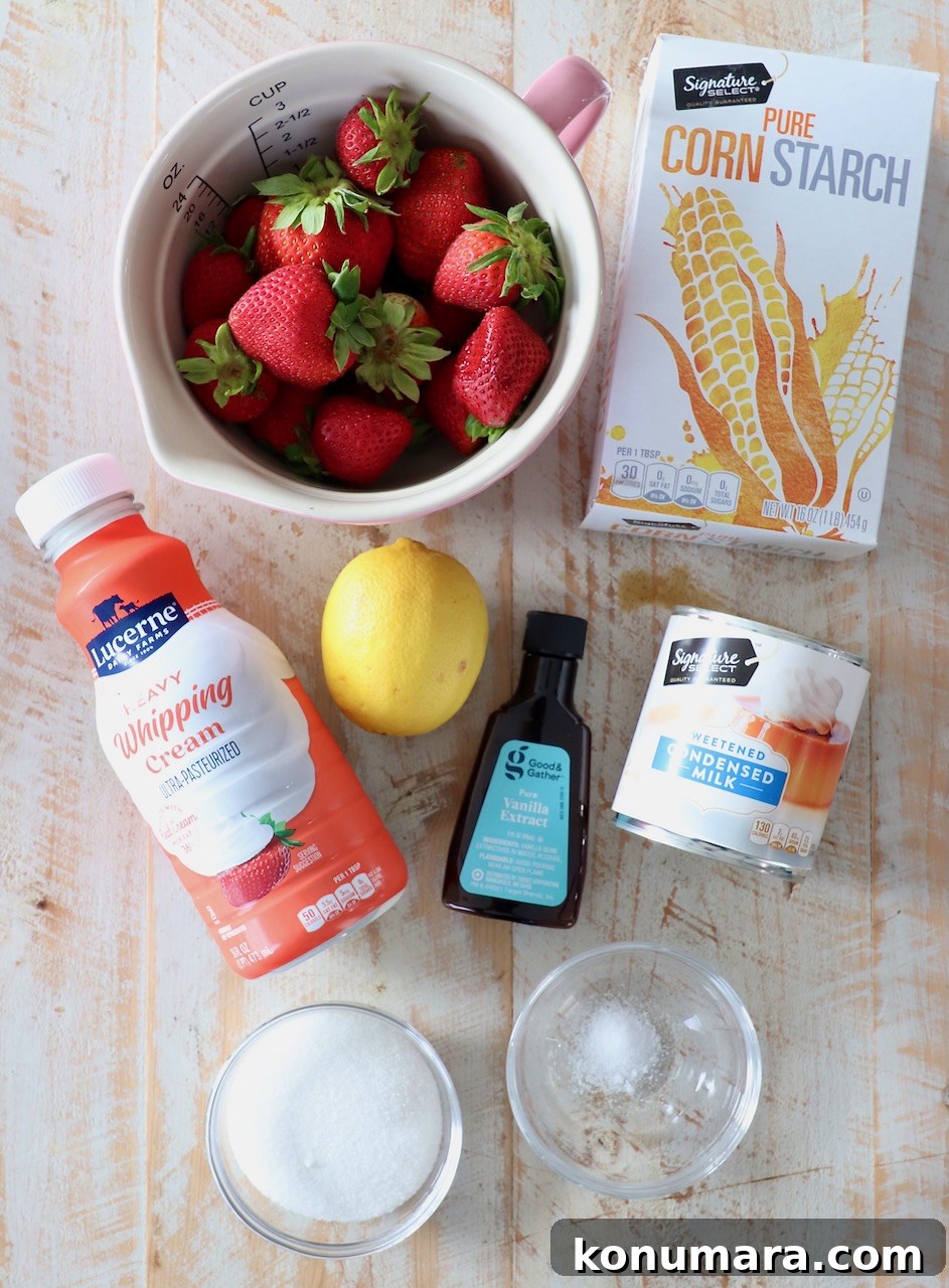 Creamy No-Churn Strawberry Ice Cream Recipe 3 ingredients for no churn strawberry ice cream on white wood board