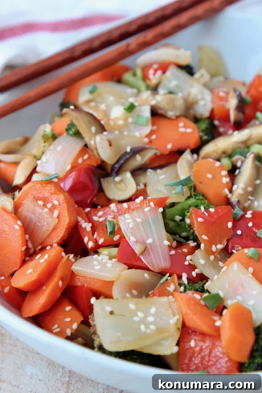 Soy Ginger Glazed Roasted Asian Vegetables Recipe 2 roasted vegetables in bowl with chopsticks