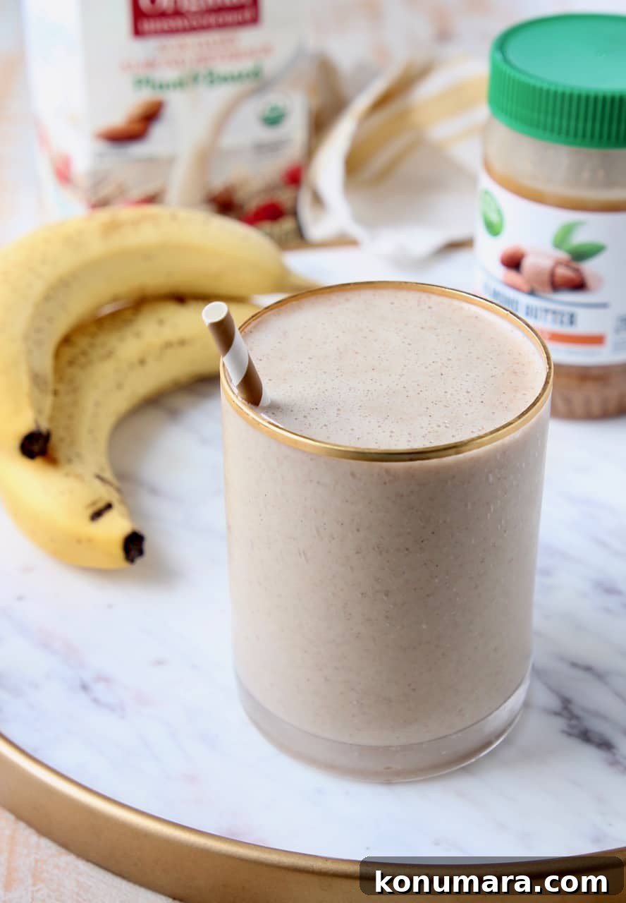 Almond Milk Smoothie Recipe with Banana and Protein 2 banana almond milk smoothie in glass with straw
