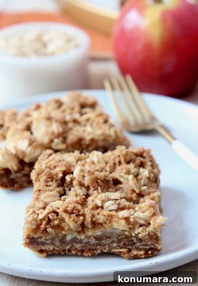 apple oatmeal bars on plate with fork