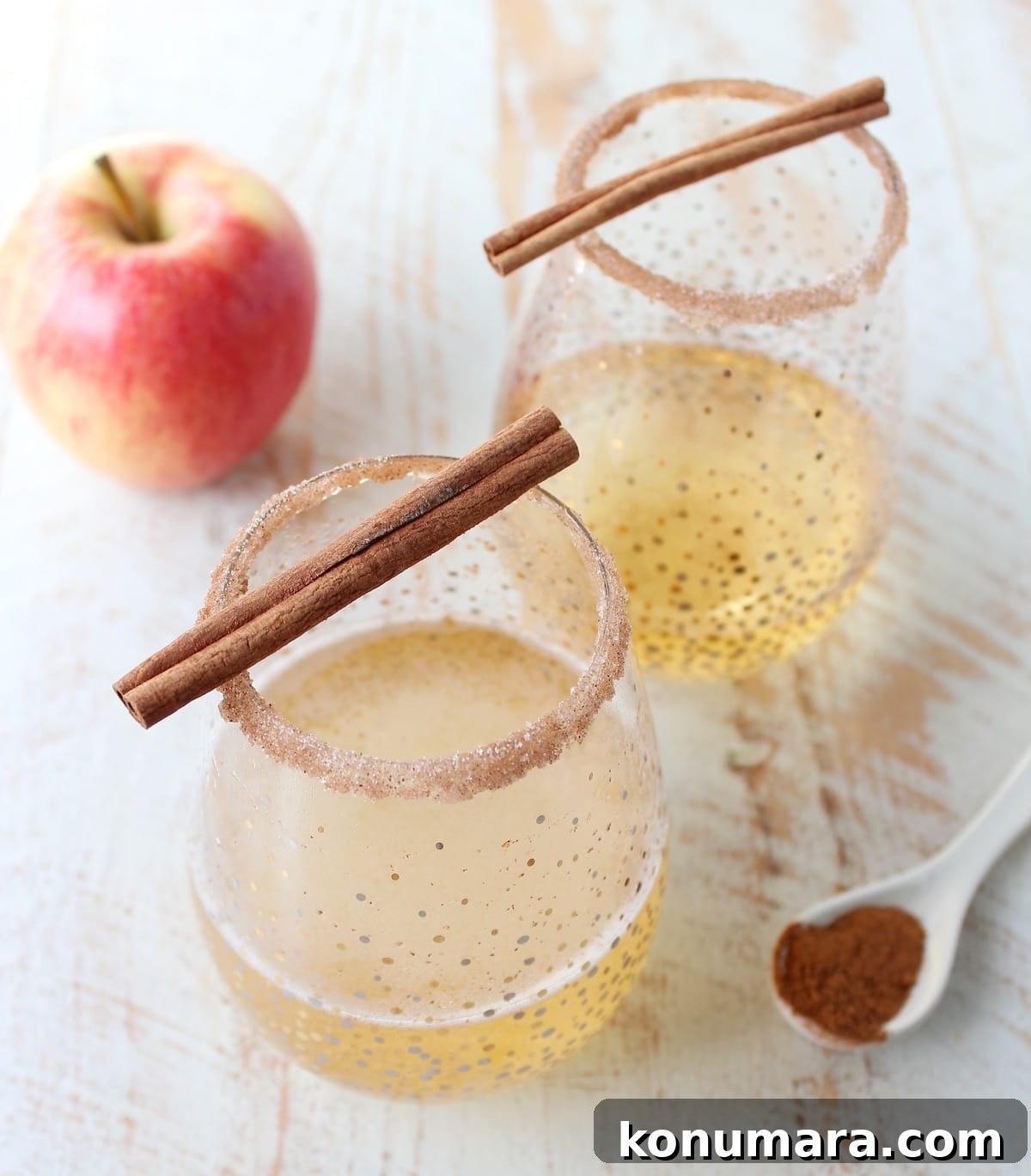 Rich apple cider is paired with sparkling champagne, vodka, maple syrup, cinnamon and nutmeg to make a festive fall apple cider champagne cocktail!