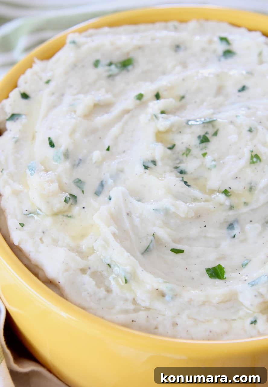 Creamy Instant Pot Mashed Potatoes Recipe 2 mashed potatoes in yellow bowl