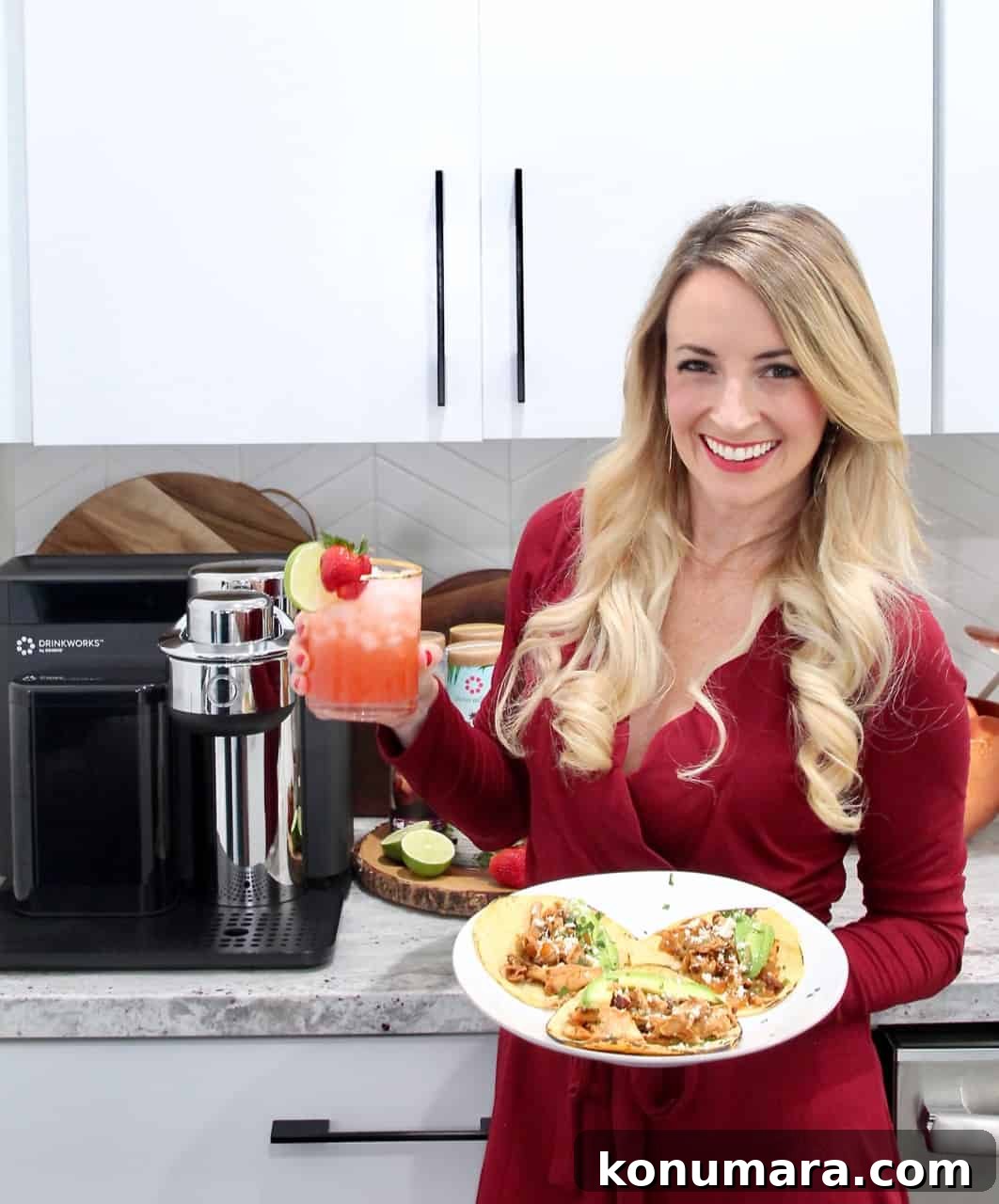 Smoky Chipotle Chicken Tacos Recipe 2 woman holding plate of tacos and strawberry margarita