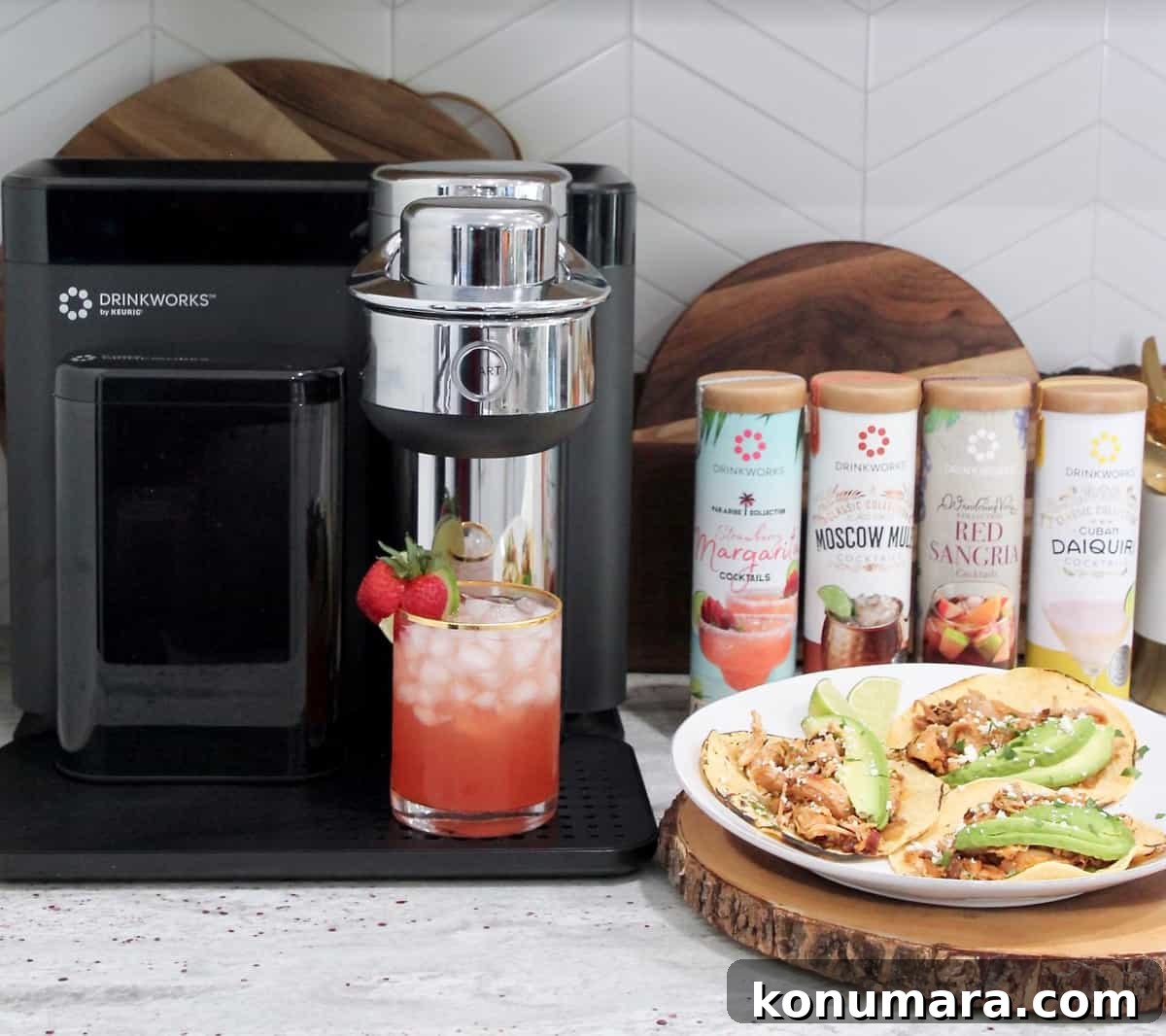 Smoky Chipotle Chicken Tacos Recipe 3 tacos on plate sitting next to drinkworks appliance with a strawberry margarita