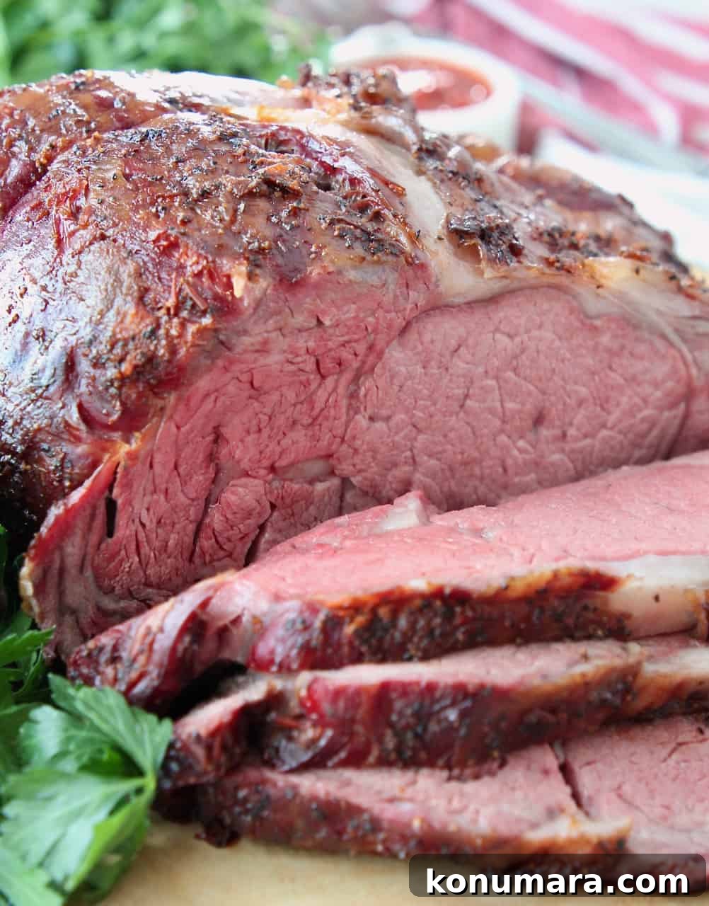 sliced smoked prime rib on wood cutting board