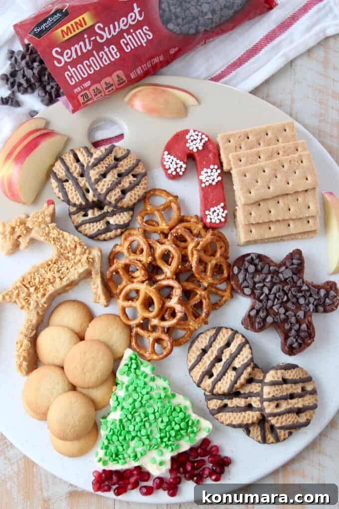 Overhead image of holiday dessert board with chocolate chips on the side