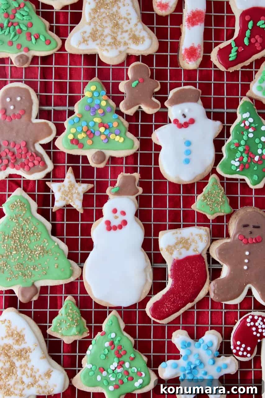 overhead image of decorated sugar cookies on metal baking rack