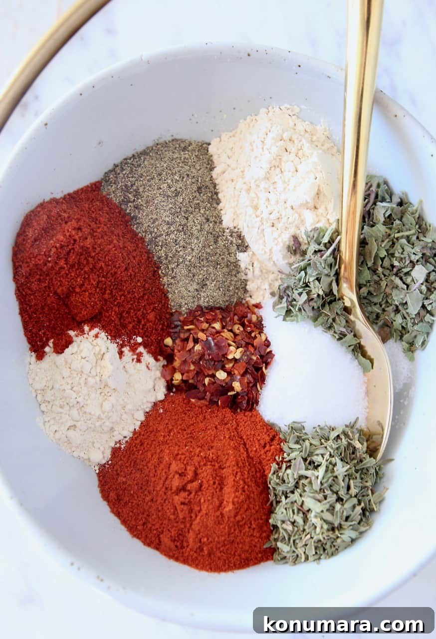 spices in bowl with gold spoon
