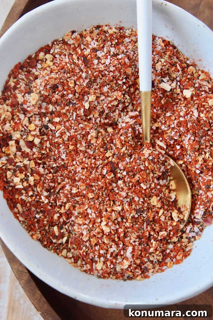 Homemade Montreal Steak Seasoning Rub 2 Overhead image of steak seasoning in bowl with spoon