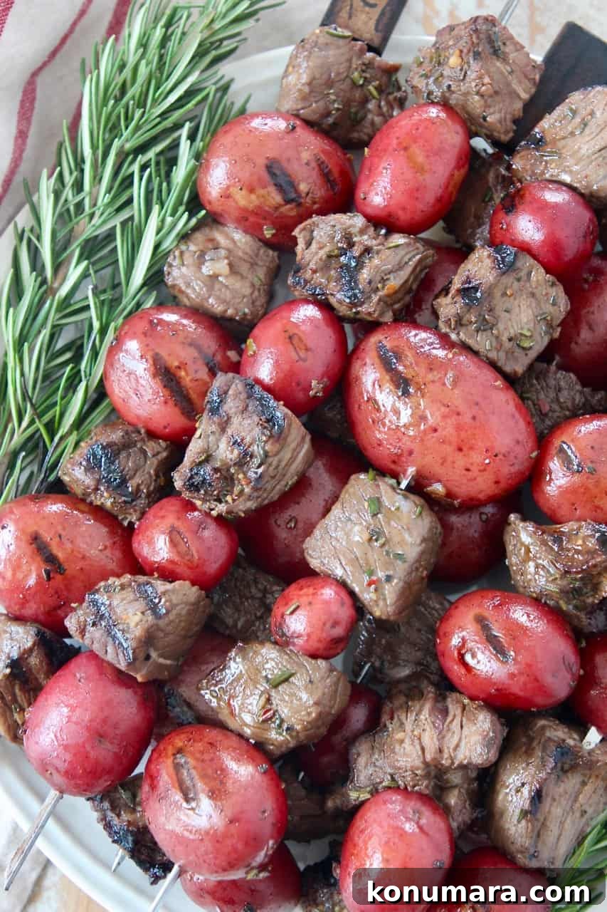 Homemade Montreal Steak Seasoning Rub 4 pieces of steak and baby potatoes on skewers stacked up on plate