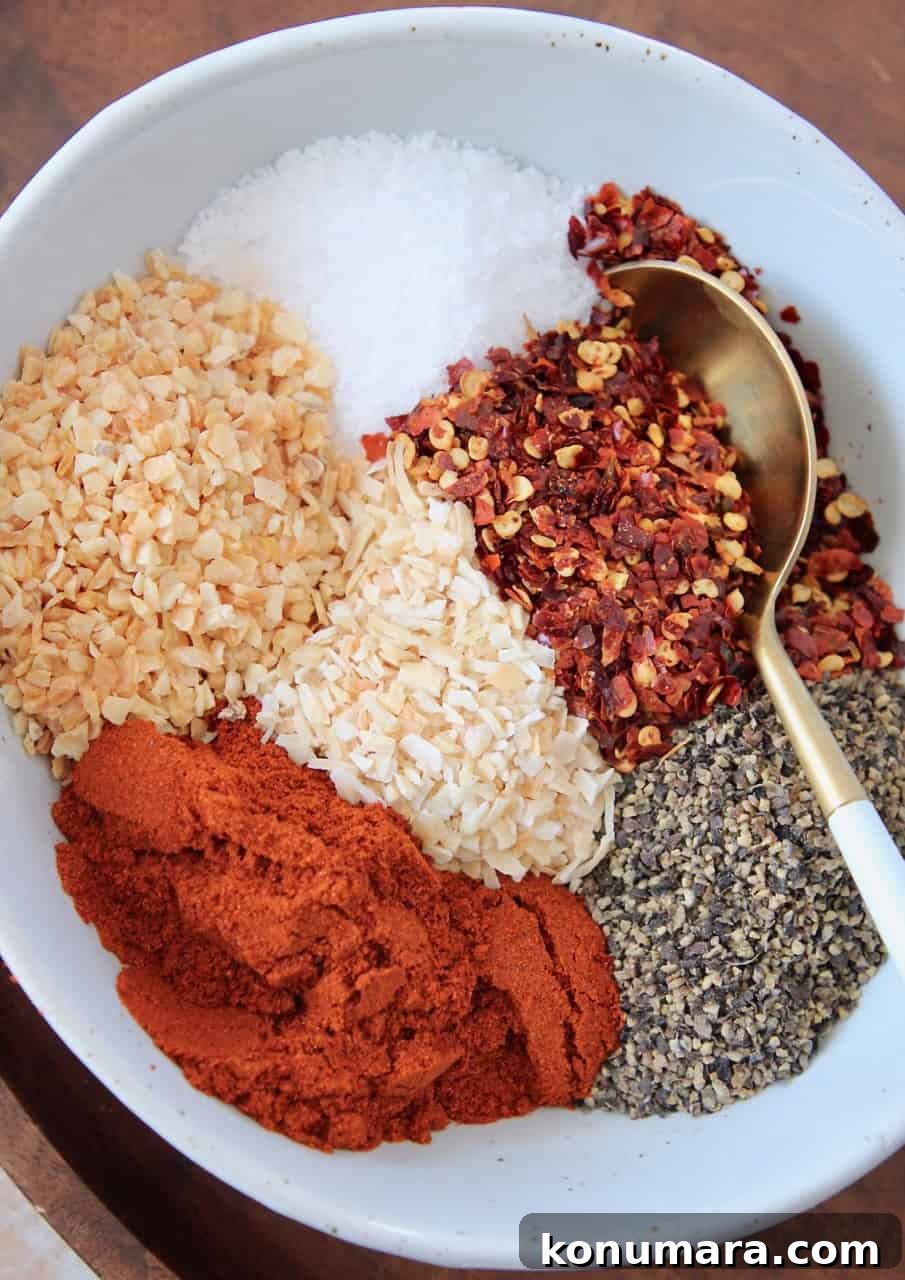 Homemade Montreal Steak Seasoning Rub 5 overhead image of spices in bowl with spoon