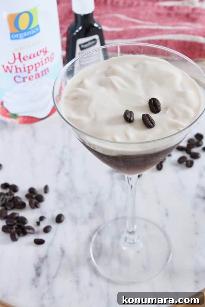 Espresso Martini Topped with Vanilla Whipped Cream 4 espresso martini topped with whipped cream in martini glass