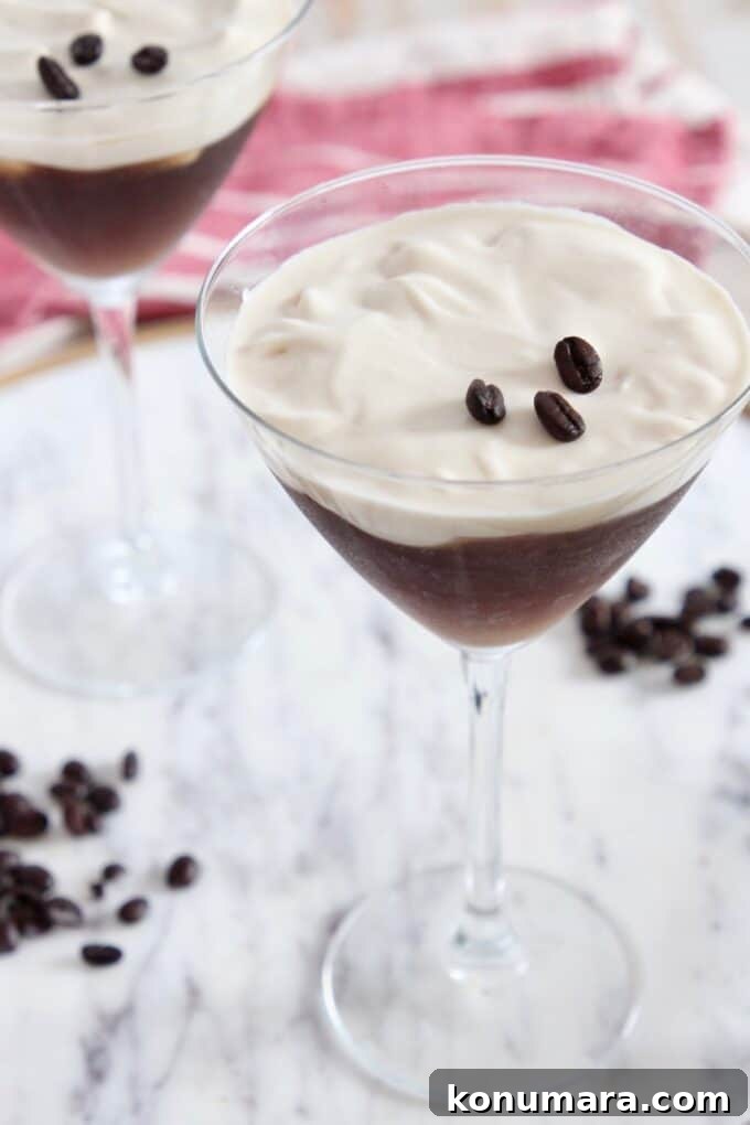 Espresso Martini Topped with Vanilla Whipped Cream 5 two espresso martinis in martini glasses sitting on marble serving tray