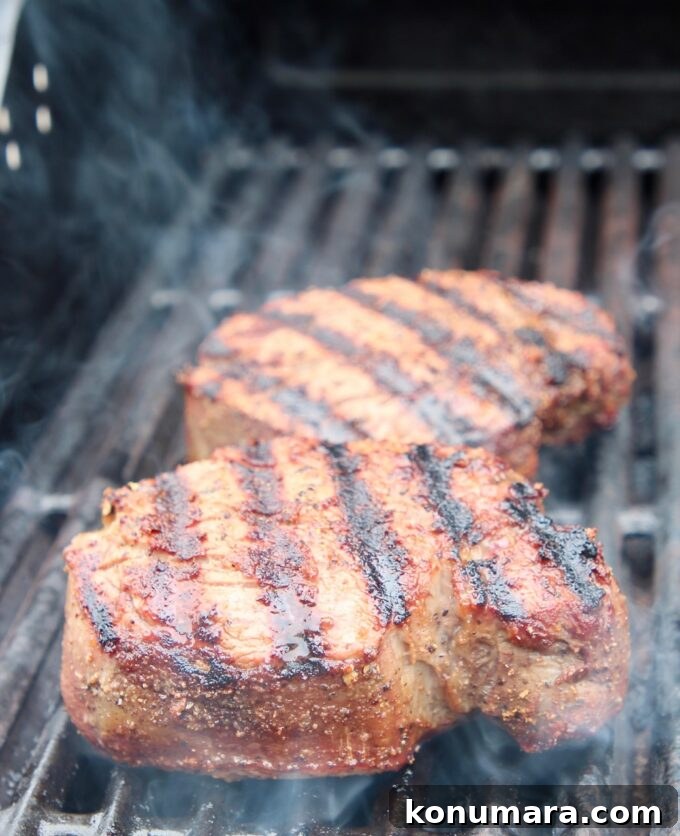 two steaks on grill
