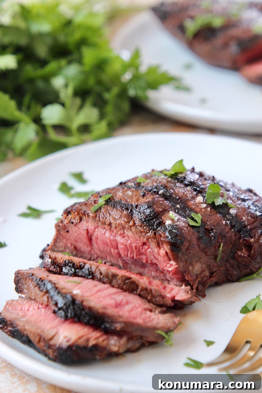 Sirloin Steak Marinade Recipe: Tender, Juicy Flavor 6 sliced grilled sirloin steak on white plate