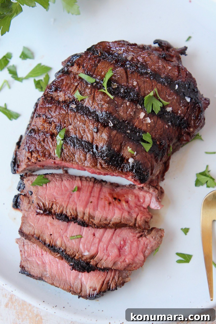 Sirloin Steak Marinade Recipe: Tender, Juicy Flavor 7 grilled sliced sirloin steak on plate