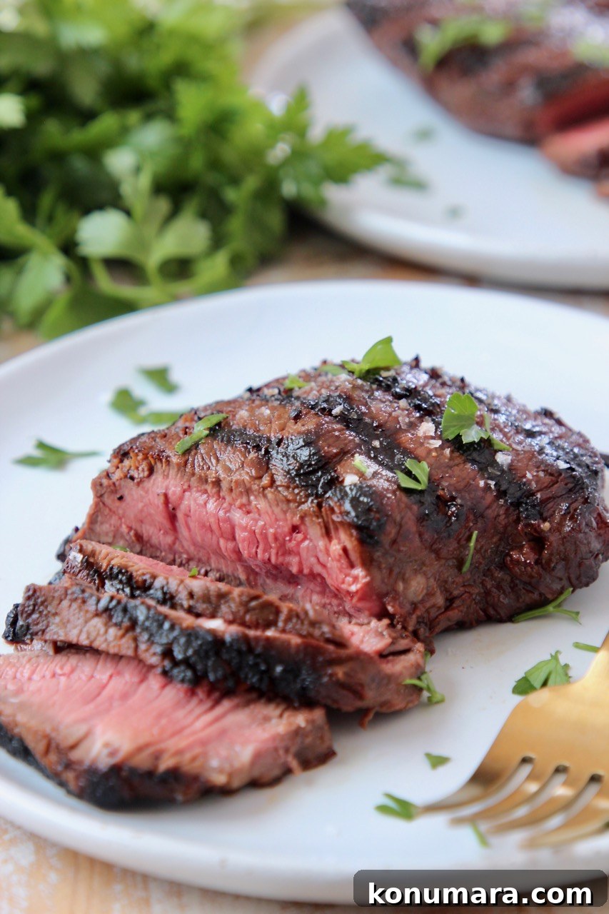 Sirloin Steak Marinade Recipe: Tender, Juicy Flavor 8 sliced sirloin steak on plate with fork