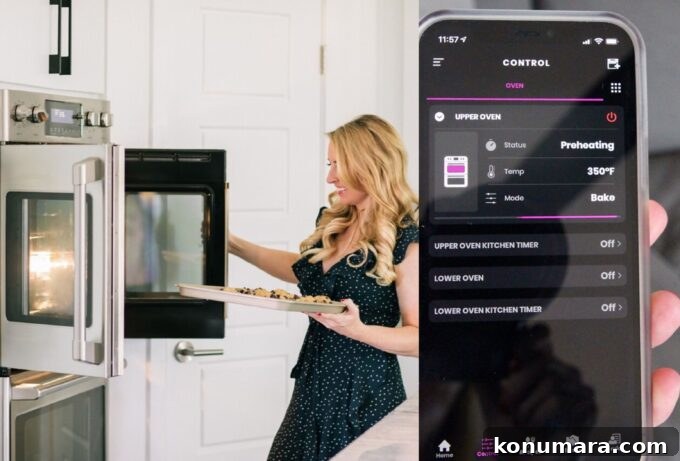 woman opening door of oven and phone with smart oven app showing