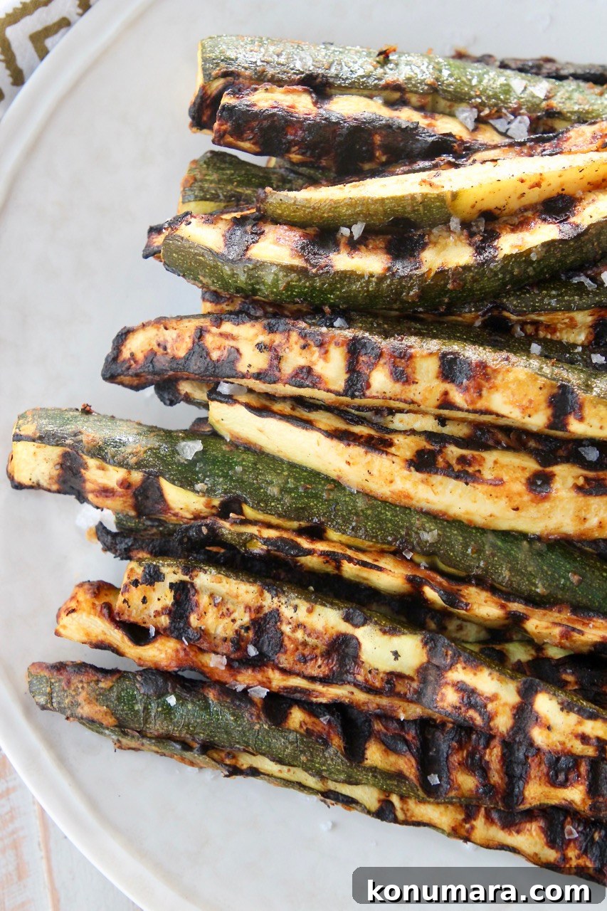 grilled zucchini spears on plate