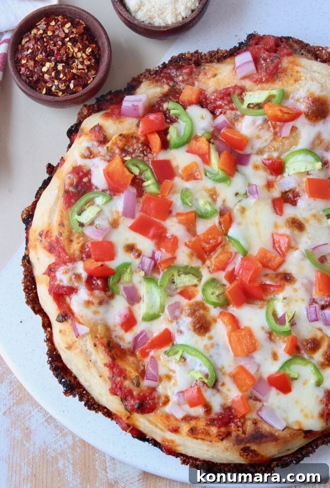 Kurt's Signature Crispy Pan Pizza Recipe 2 whole cooked pizza on marble serving tray