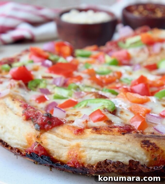 Kurt's Signature Crispy Pan Pizza Recipe 8 cooked pan pizza with crispy cheese crust and vegetable toppings