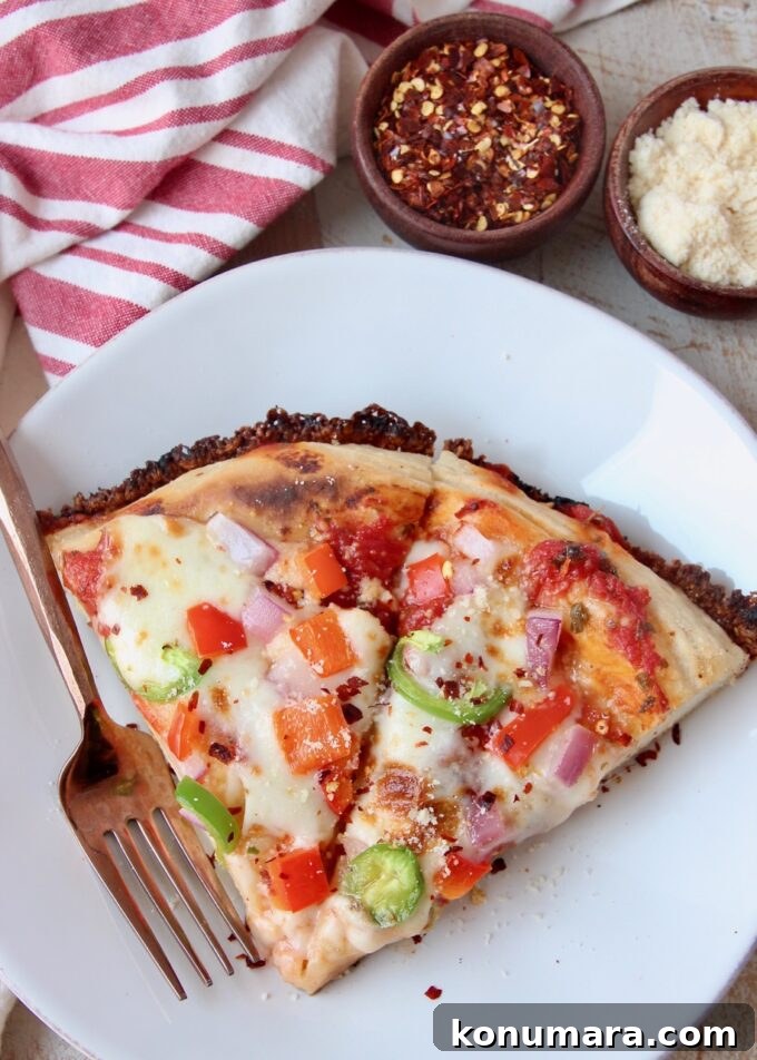 Kurt's Signature Crispy Pan Pizza Recipe 9 two slices of pizza on white plate with fork