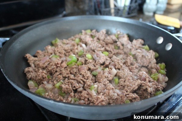 Pumpkin Chili Recipe with Black Beans 5 Cooked ground beef with diced onions and bell peppers in a skillet