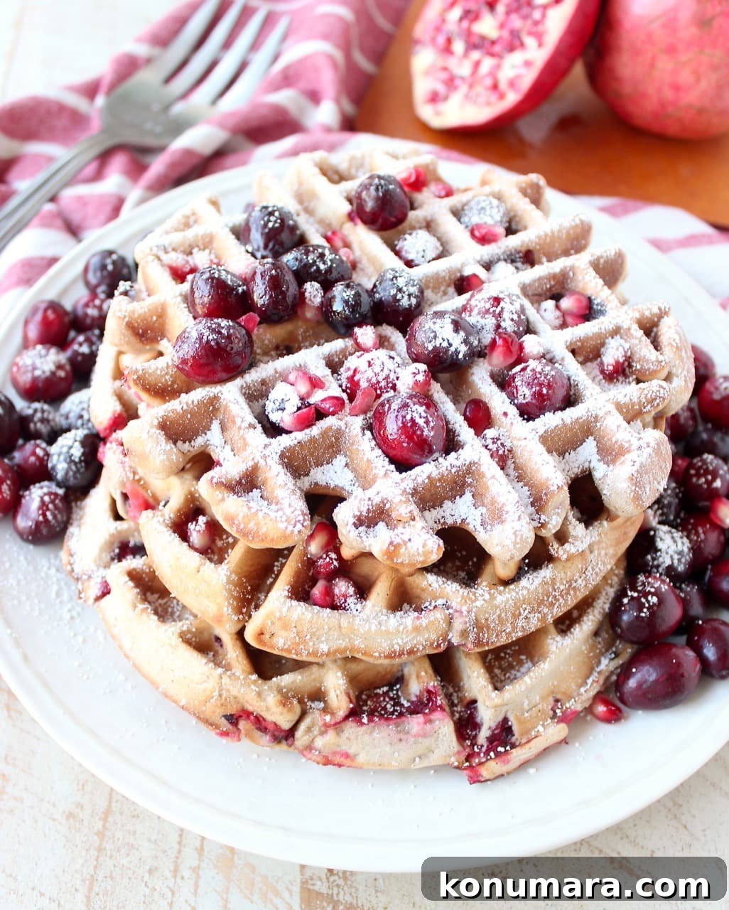 Fresh cranberries & pomegranates add a delicious burst of tartness & sweetness to this easy waffles recipe, perfect for fall breakfast or holiday brunch!