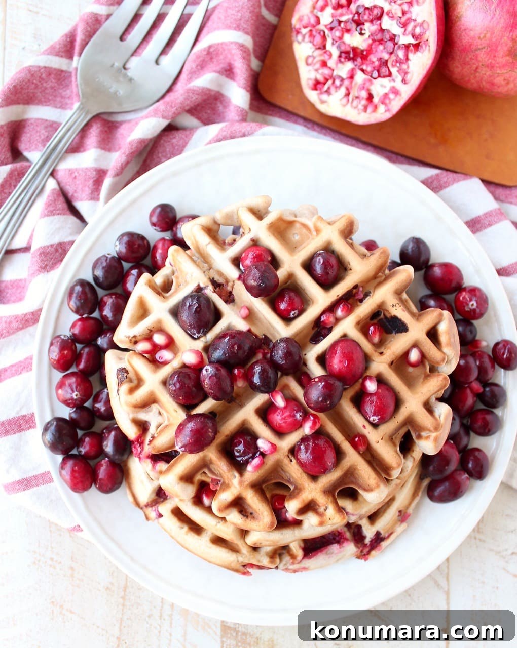 Fresh cranberries & pomegranates add a delicious burst of tartness & sweetness to this easy waffles recipe, perfect for fall breakfast or holiday brunch!