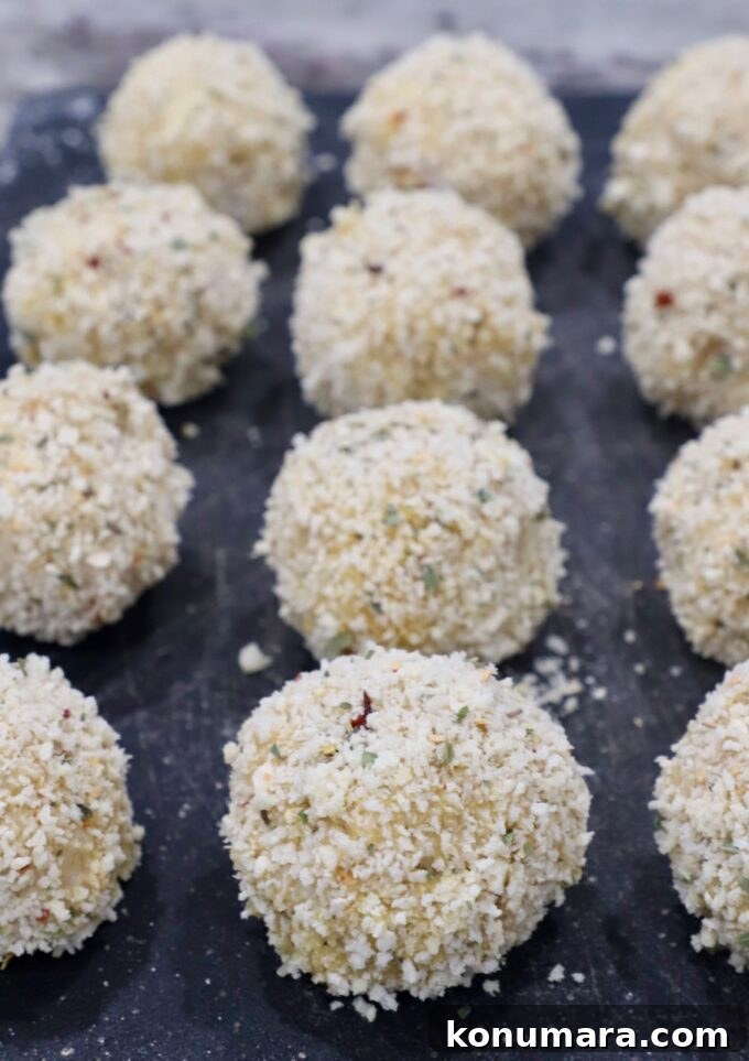 breadcrumb coated rice balls on cutting board