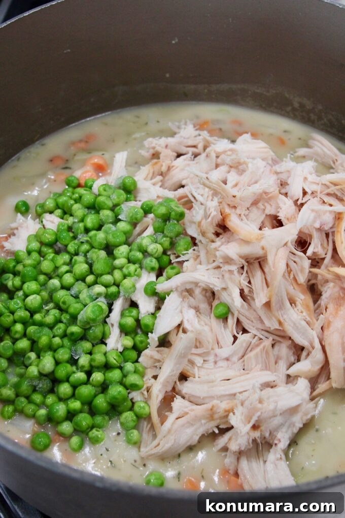 peas and shredded chicken in a pot