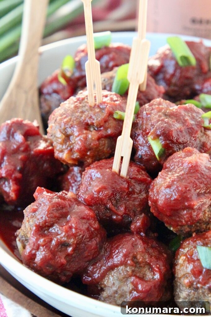 bbq meatballs in bowl with toothpicks in the meatballs