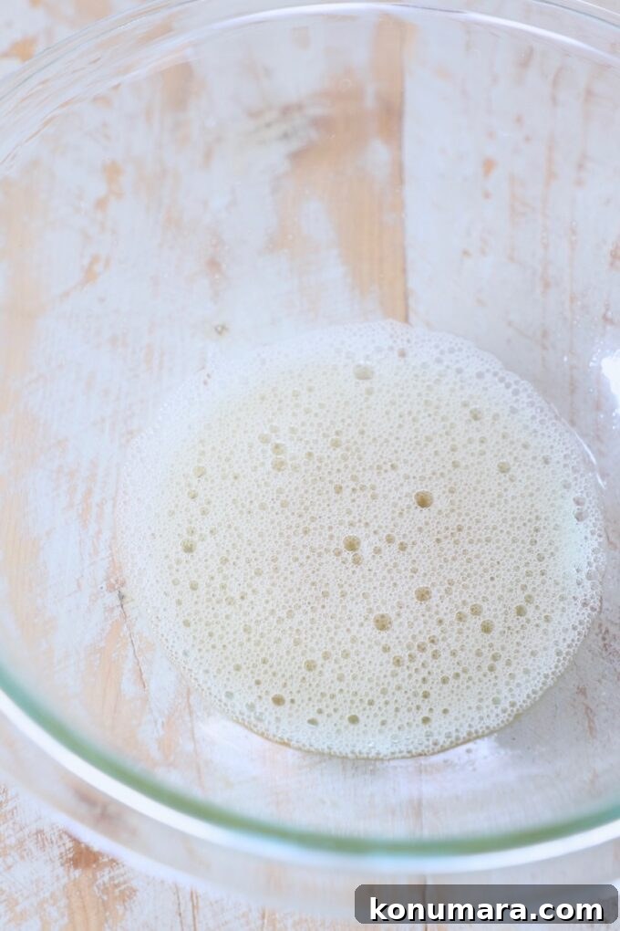 whisked egg white in glass bowl