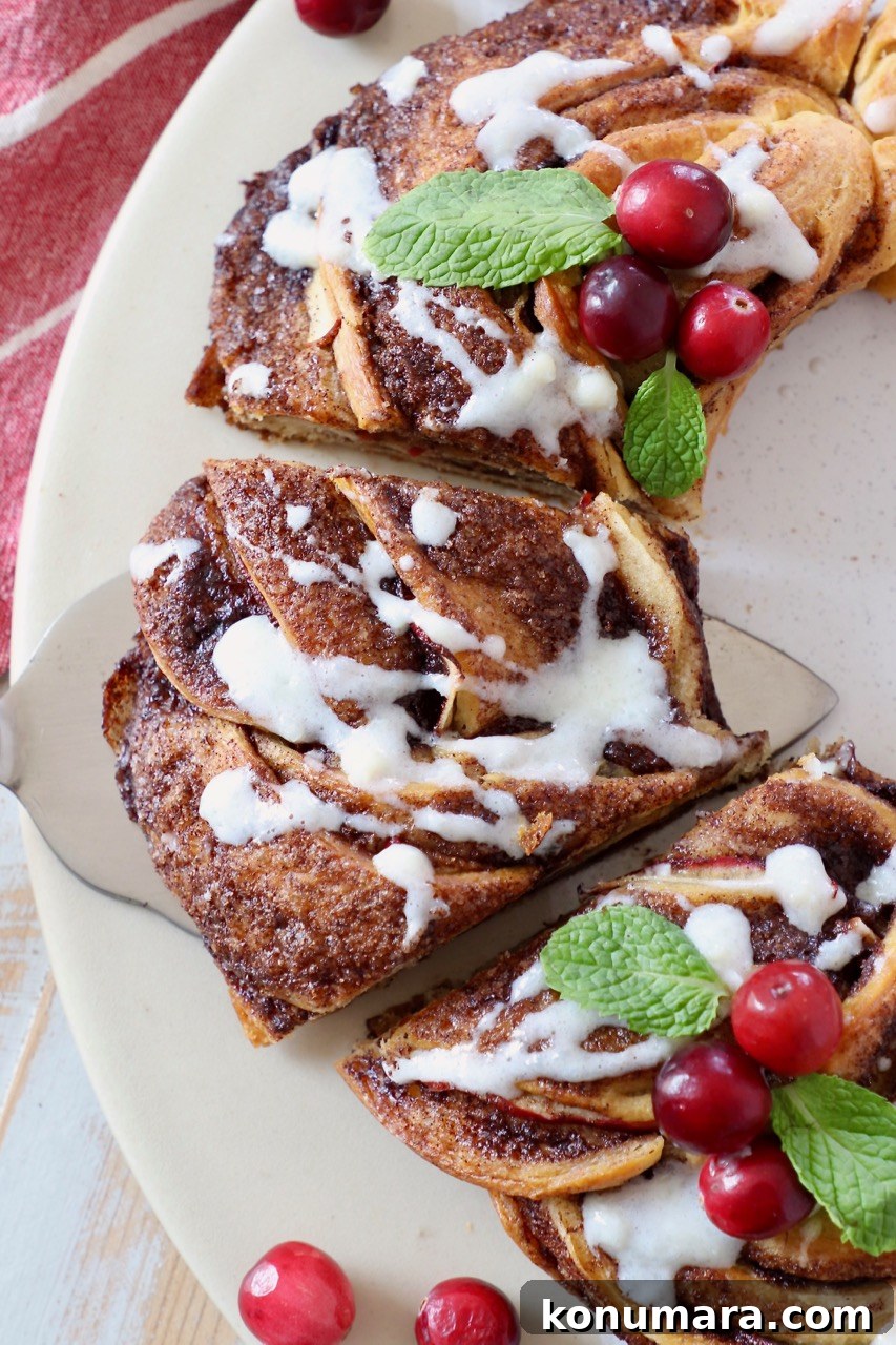 slice of cinnamon roll wreath topped with cream cheese frosting