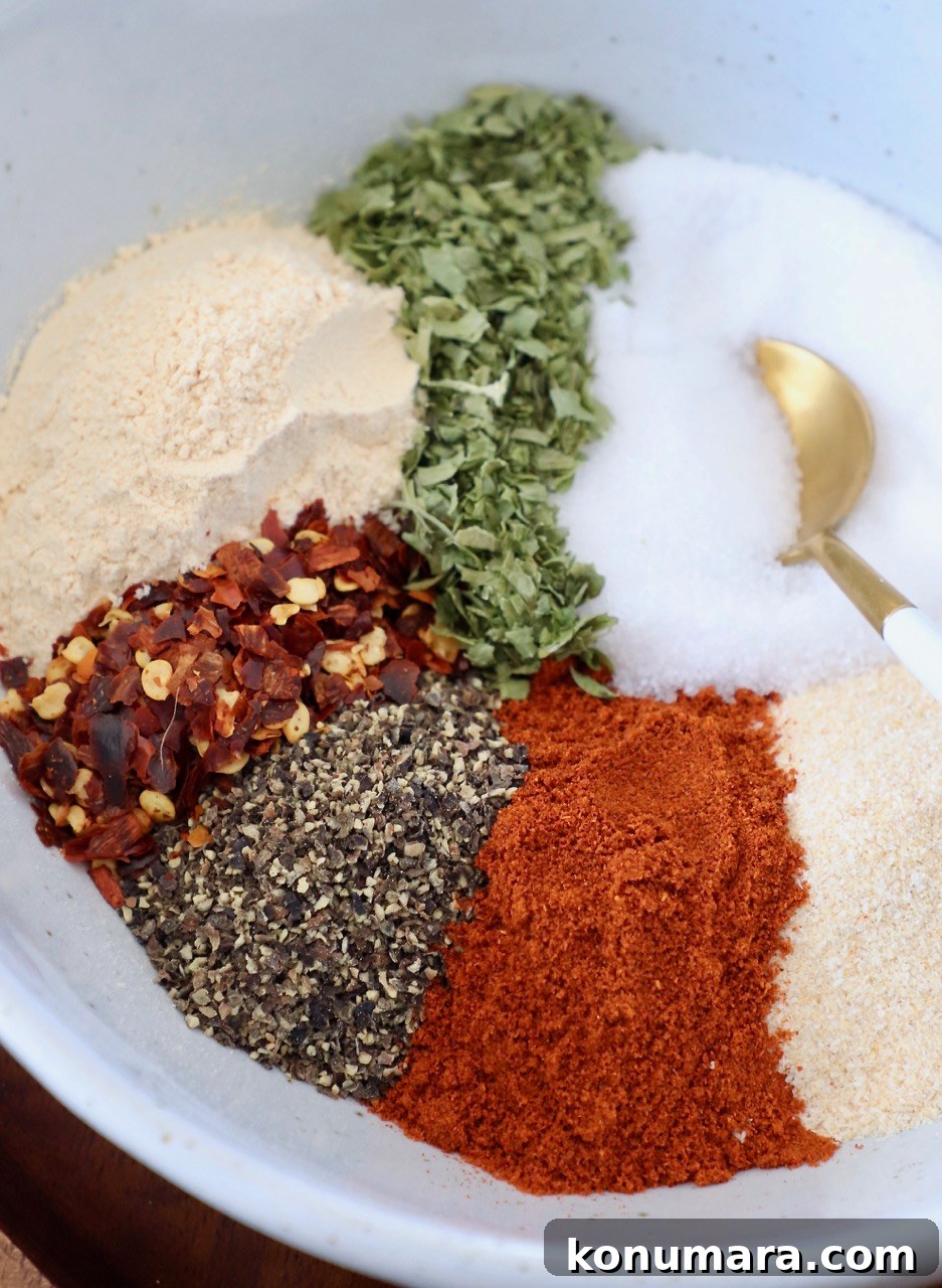 spices in bowl with gold spoon