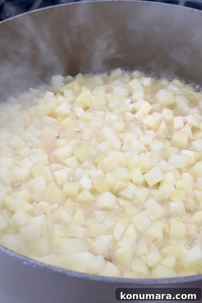 diced potatoes in liquid in a large pot