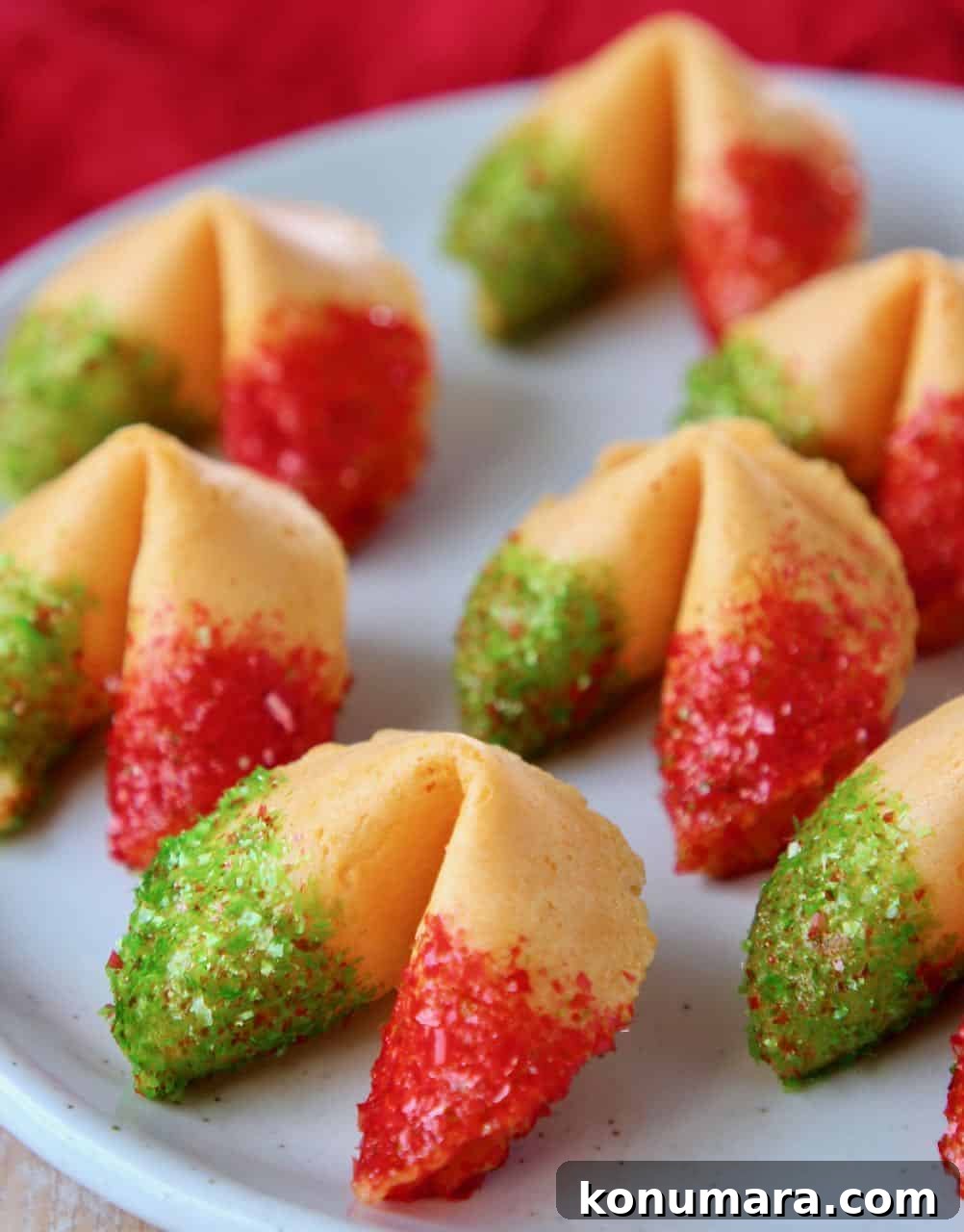 Fortune cookies with red and green glitter on plate