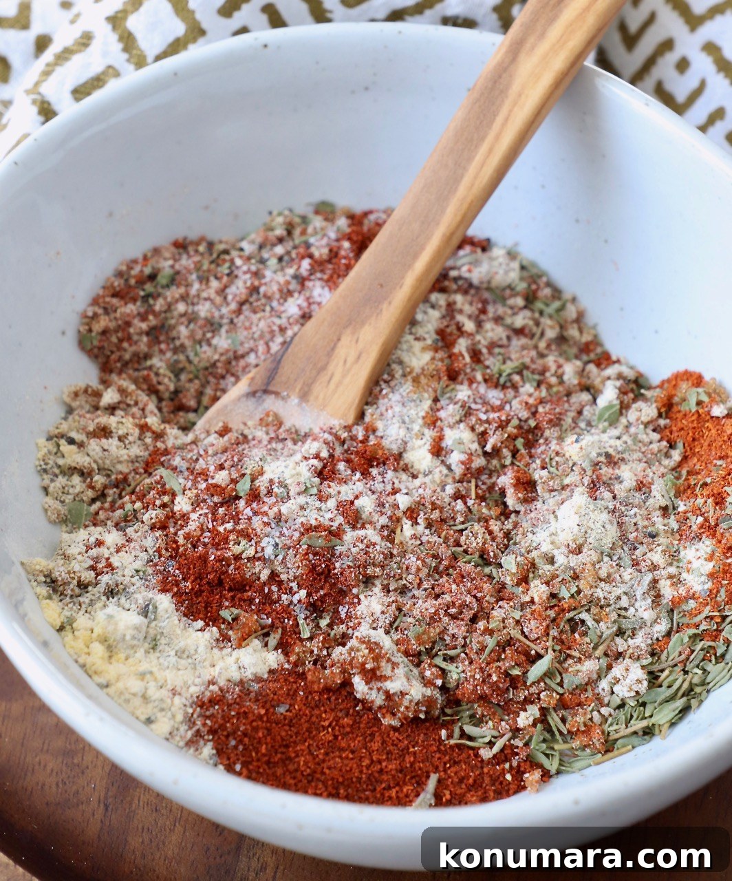 Savory Pork Chop Seasoning Blend for Juicy Grilled Chops 2 pork chop seasoning blend in bowl with wooden spoon