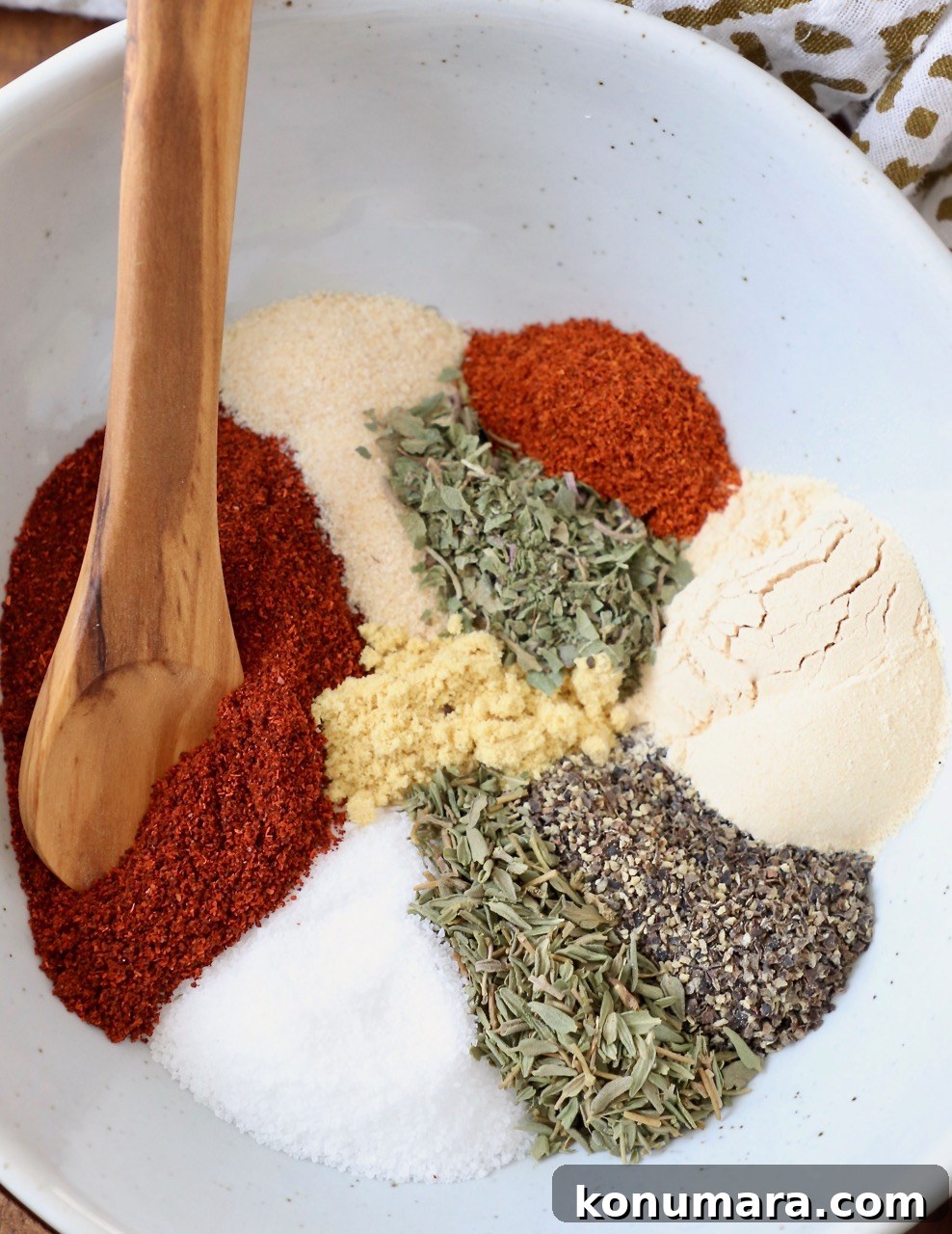 Savory Pork Chop Seasoning Blend for Juicy Grilled Chops 4 herbs and spices in bowl with wooden spoon