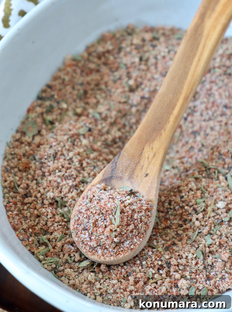 Savory Pork Chop Seasoning Blend for Juicy Grilled Chops 6 pork chop seasoning in bowl with wood spoon