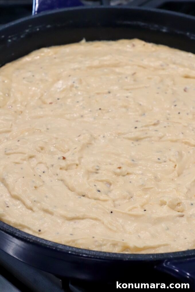 cheesy sauce in skillet on stove