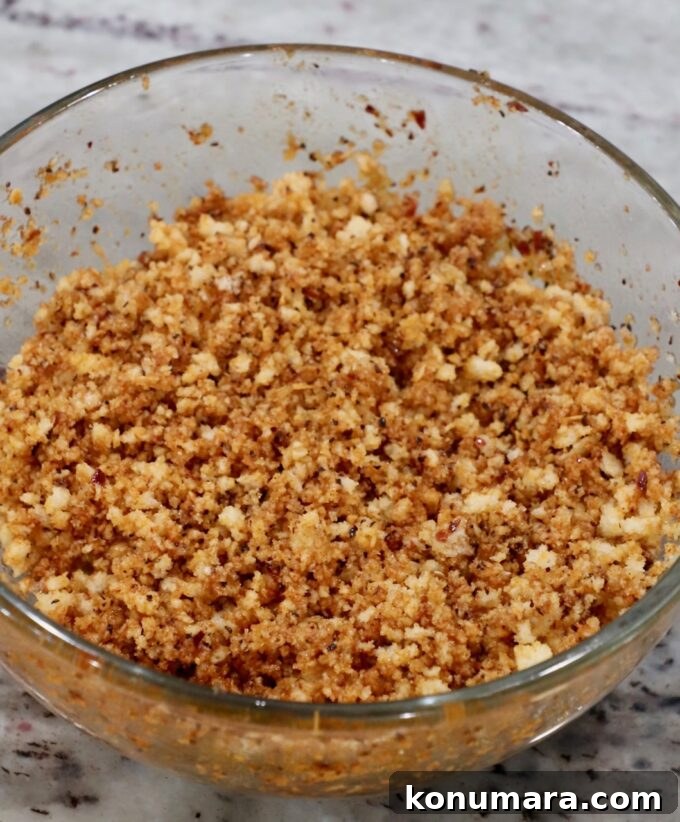 seasoned panko breadcrumbs in glass bowl