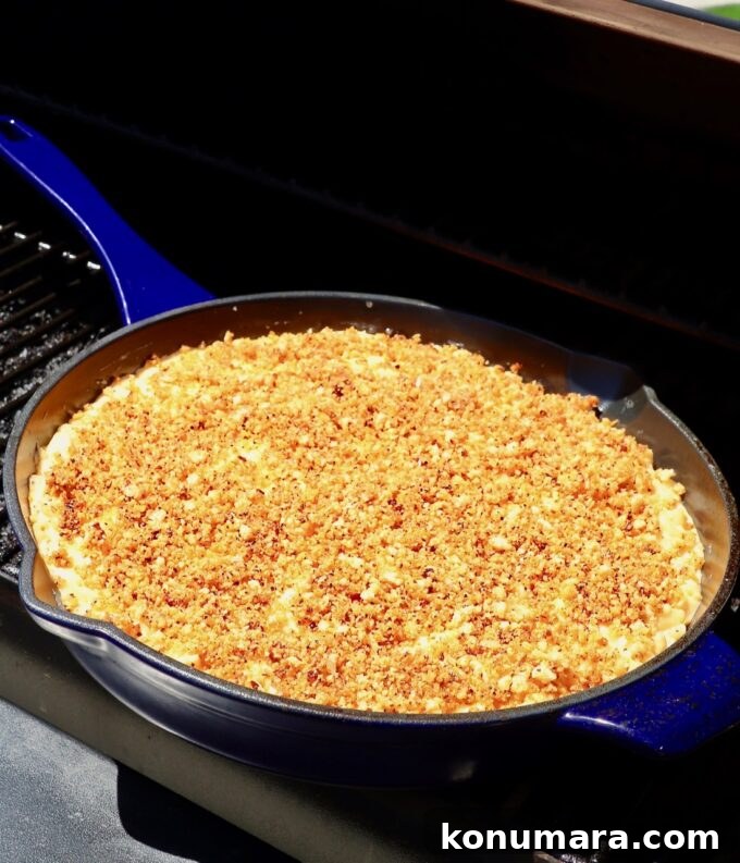 skillet of mac and cheese in smoker