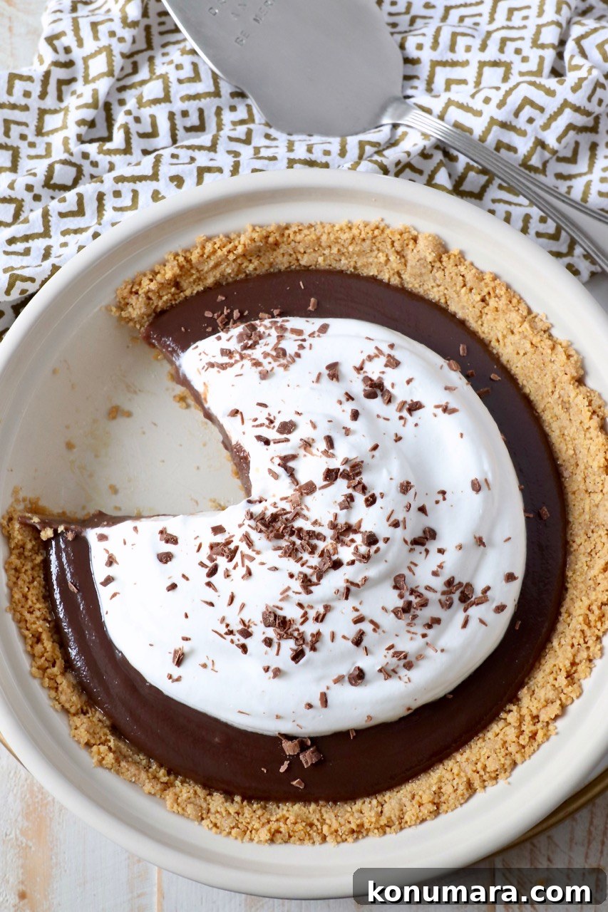 chocolate pie with sliced taken out of it