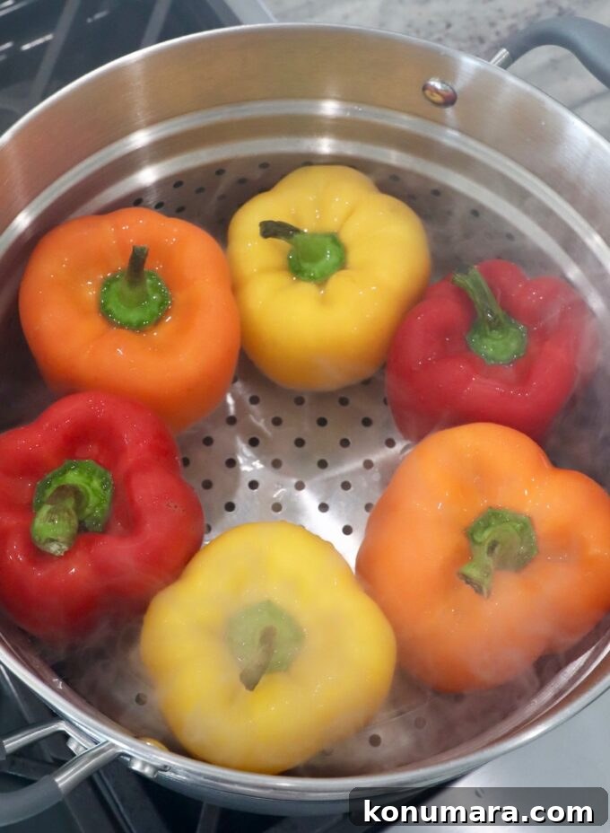 Bell peppers in steamer basket on stove