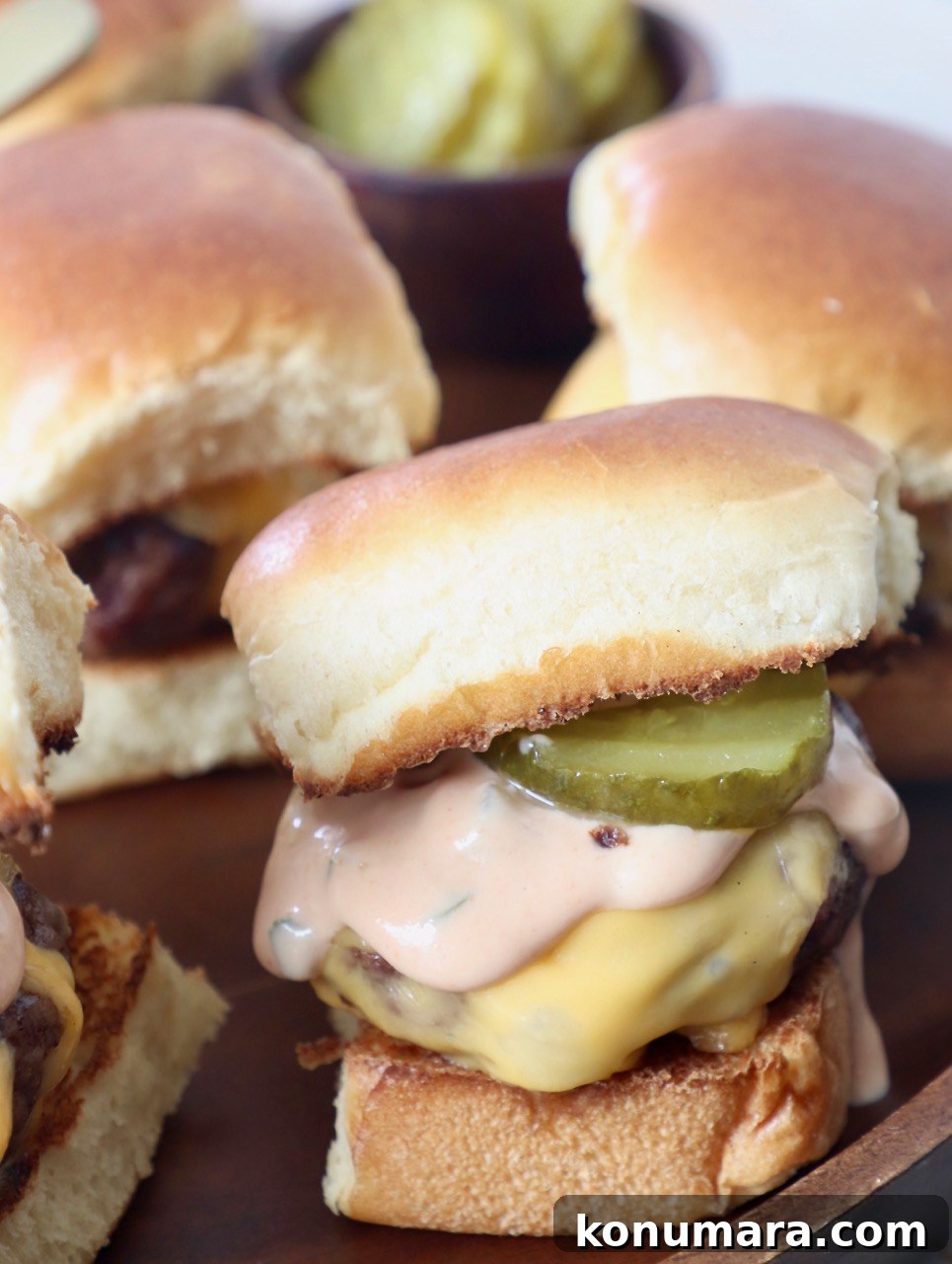 Juicy Cheeseburger Sliders Recipe with Caramelized Onions 4 cheeseburger slider with burger sauce and pickles