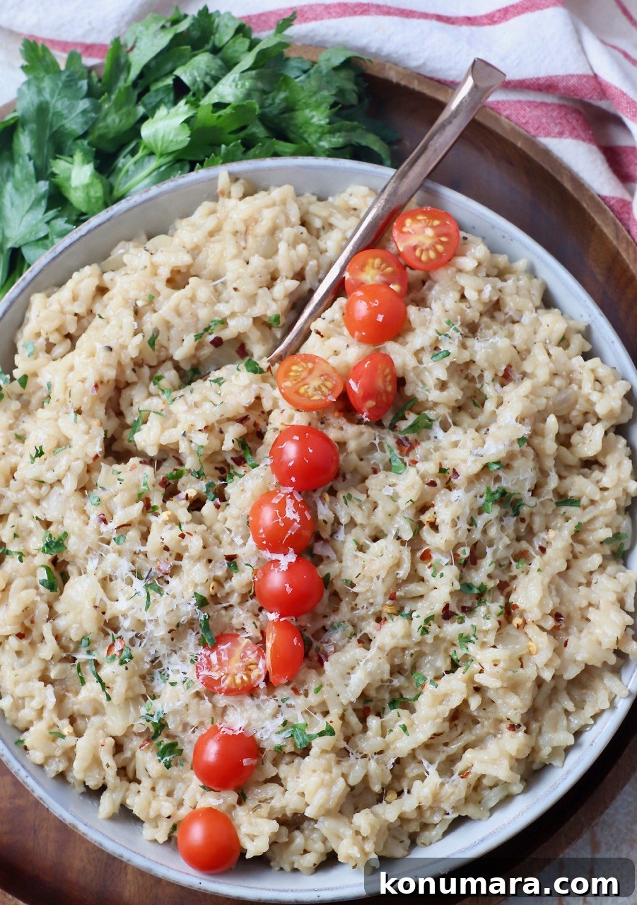 Creamy Instant Pot Risotto Recipe 10 risotto in bowl topped with halved cherry tomatoes