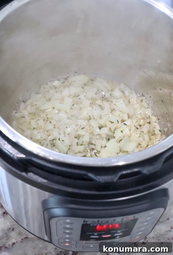 Creamy Instant Pot Risotto Recipe 4 diced onions and garlic in Instant Pot